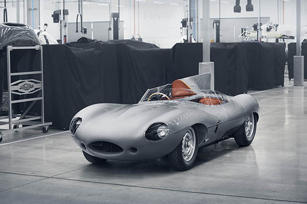 D-Type Jaguar silver racing in a garage