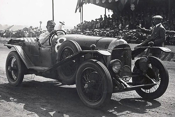 John Duff 1924 Stationary In A Racing Car On A Race Track