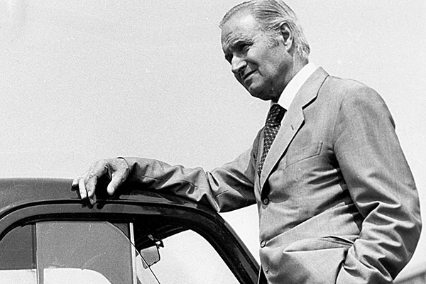 Monochrome Dante Giacosa Leaning On The Roof Of A Fiat 500