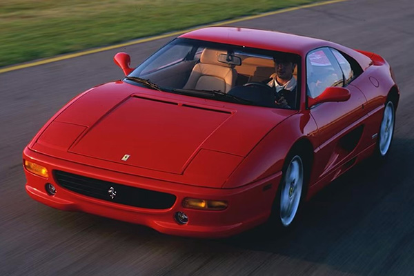 Red Ferrari F355 Berlinetta Being Driven