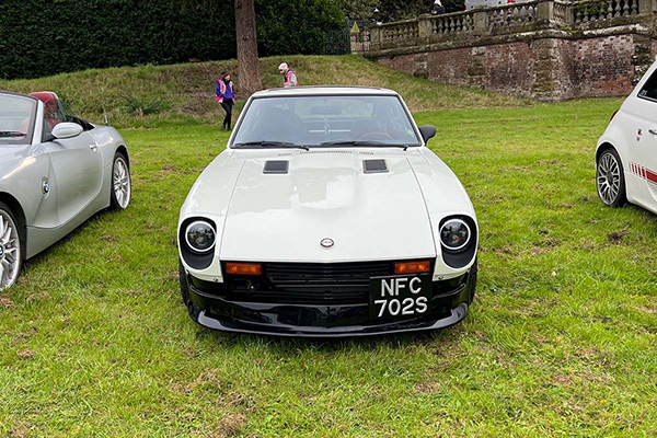 White Datsun on grass at Chateau Impney