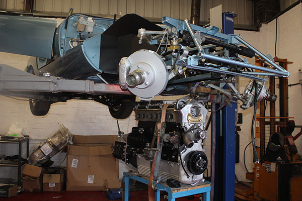 Elevated blue Jaguar E Type chassis