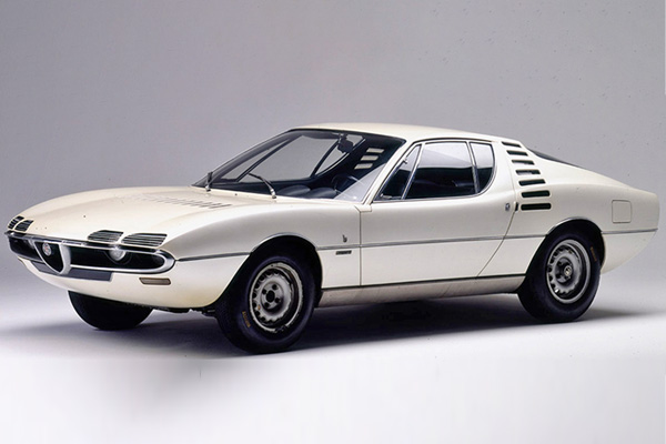 White Alfa Romeo Montreal against a grey background