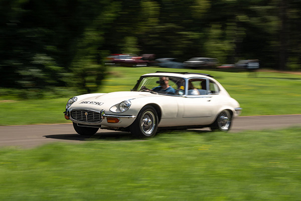 Cream E Type Jag driving along grass a verge.jpg