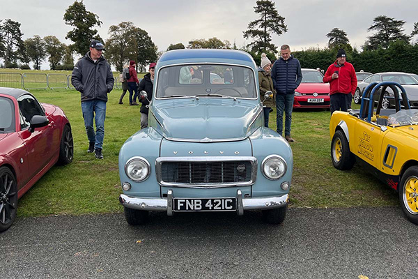 Egg shell blue Volvo Duett PV on grass at Chateau Impney