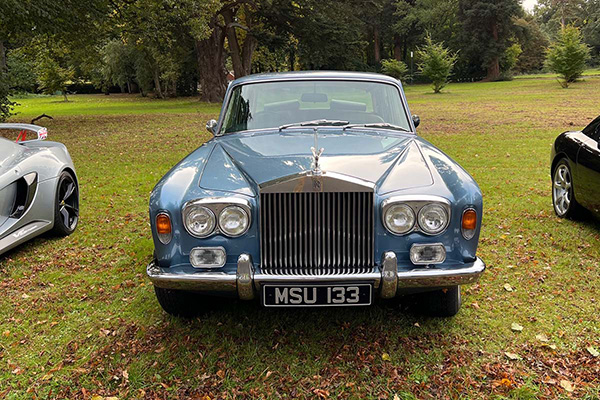 Blue Rolls Royce Silver Shadow on grass at Chateau Impney