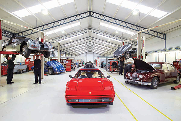 Red Ferrari 328 courtesy of  Classic Motor Cars in a garage