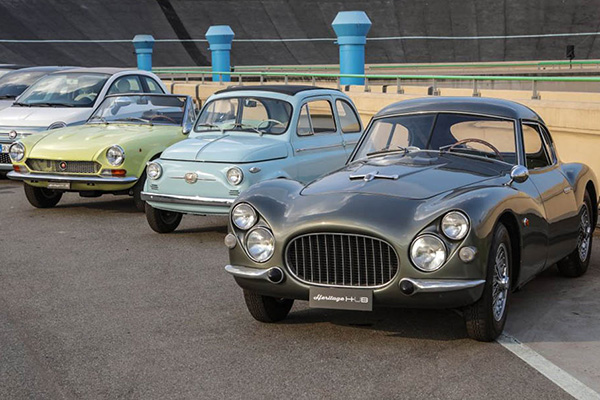 Staggered Row Of Various Versions Of Parked Classic Fiats